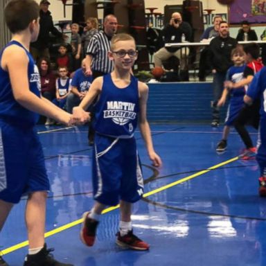 VIDEO: 9-year-old with cerebral palsy scores during basketball game