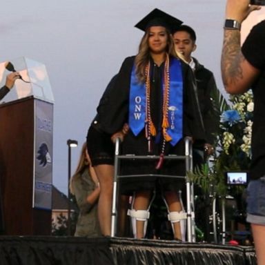 VIDEO: High school senior paralyzed in gymnastics incident walks at graduation