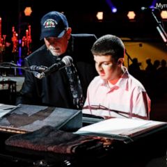 Billy Joel plays piano with blind fan before concert in New York City