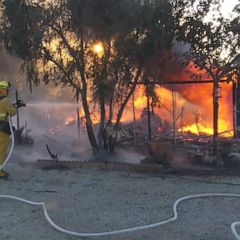 Firefighters facing blazes charged by gale-force winds
