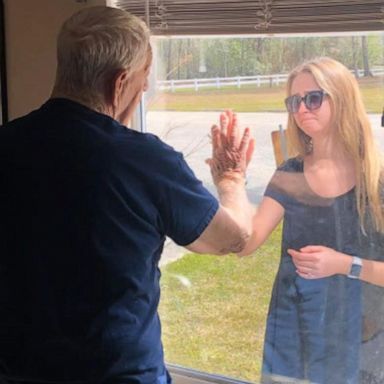 VIDEO: Woman shares engagement with grandfather through window