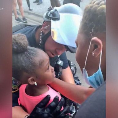 VIDEO: Powerful moment shared between police officer and young girl