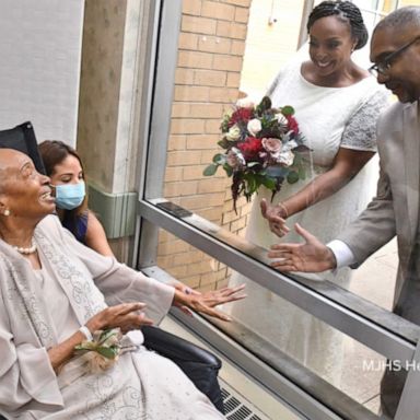 VIDEO: Nursing home resident watches daughter’s wedding from window