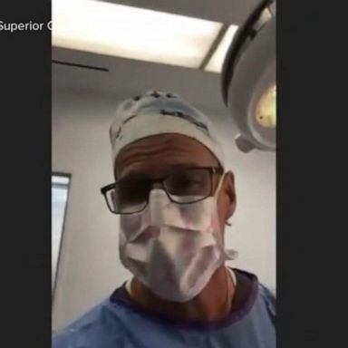 VIDEO: Doctor under fire for attending virtual trial while performing surgery