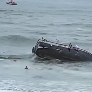 VIDEO: Fishing boat slams into rocks, breaks apart with 25 people on board