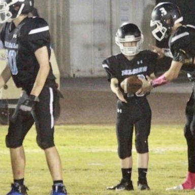 VIDEO: America Strong: Highschool freshman with down syndrome scores touchdown