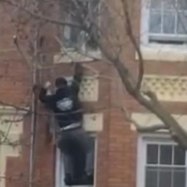 VIDEO: Hero scales burning home to rescue children from window