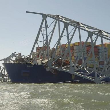 VIDEO: Crews scramble to clear bridge collapse debris