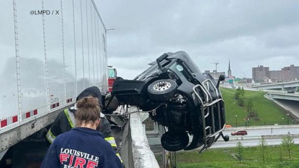 Louisville crash leads to dramatic rescue of a semi truck driver dangling off bridge
