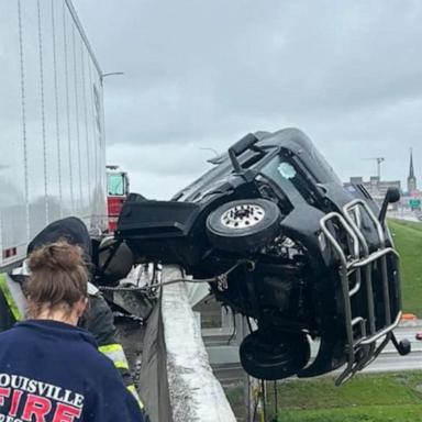 VIDEO: Louisville crash leads to dramatic rescue of a semi truck driver dangling off bridge