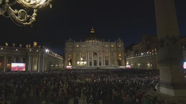 St. Peter's Square packed with people as first smoke billows from Sistine Chapel