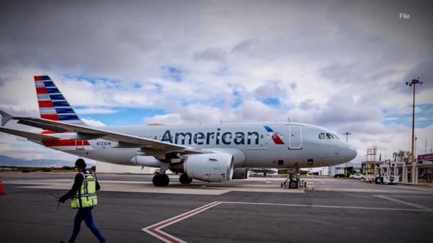 Smoke, flames from American Airlines jet's engine mid-flight forces emergency landing