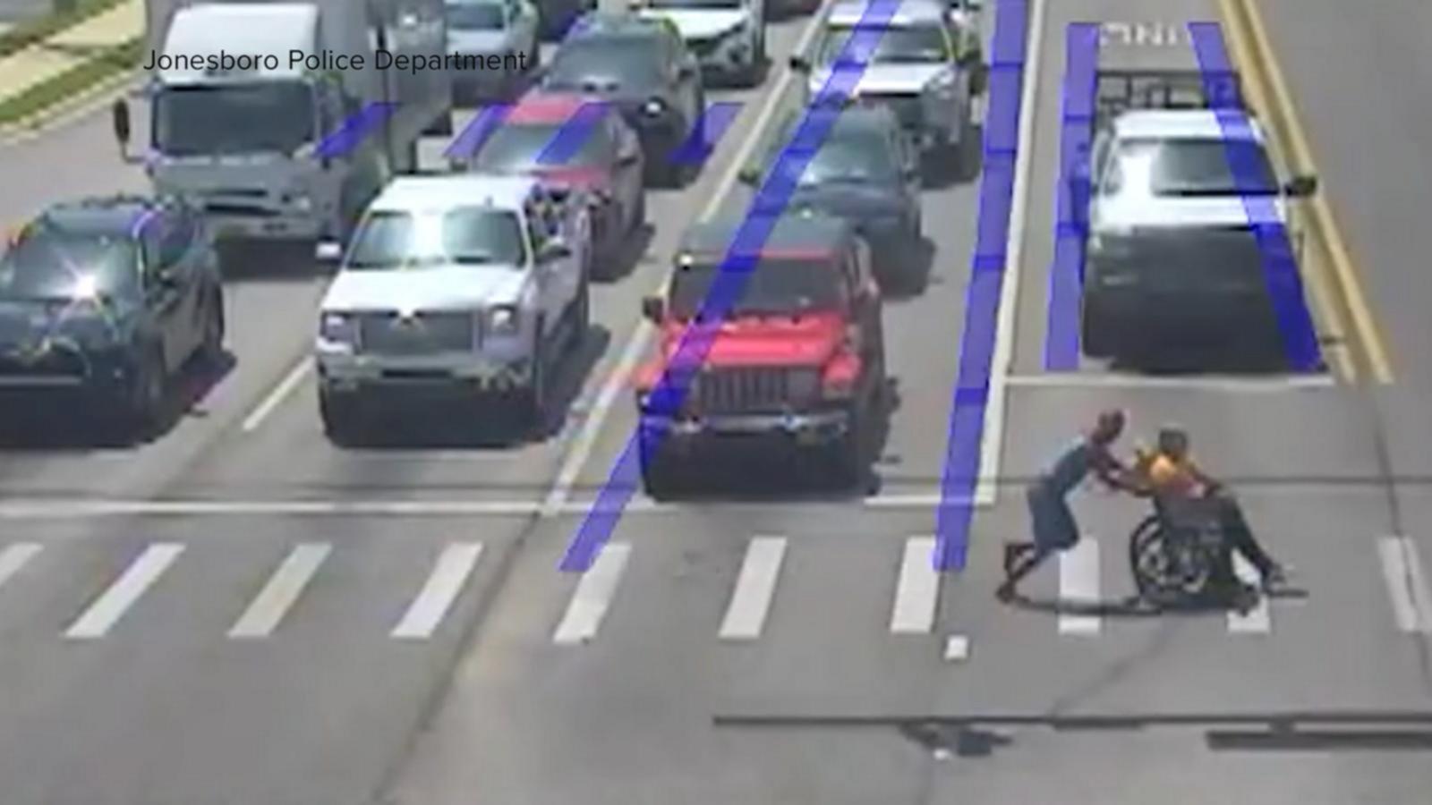 WATCH:  Real-life Spider-Man jumps into action to help man cross busy intersection