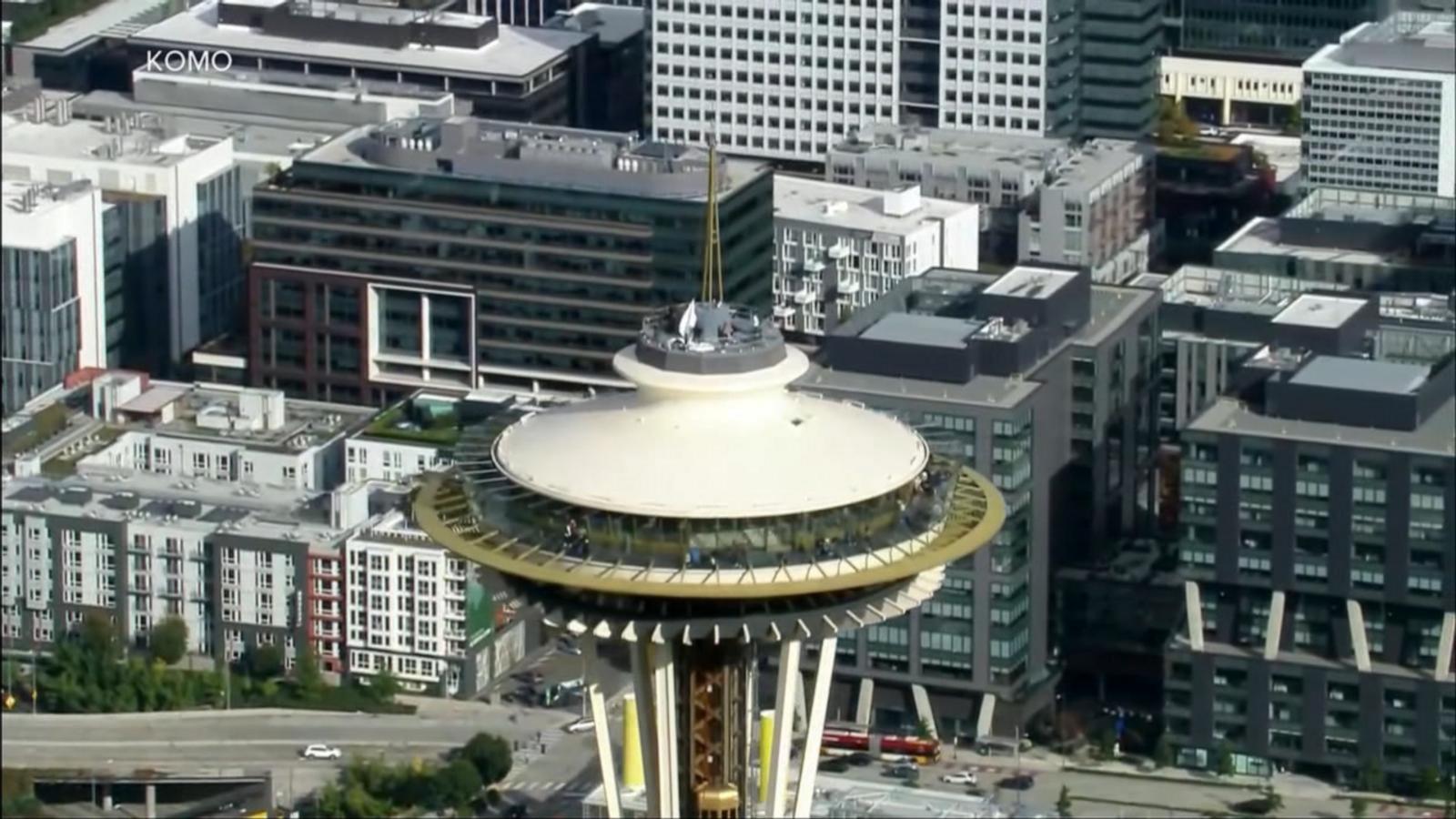 WATCH:  Daredevils scale and jump from Space Needle in Seattle
