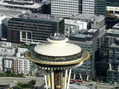 WATCH:  Daredevils scale and jump from Space Needle in Seattle