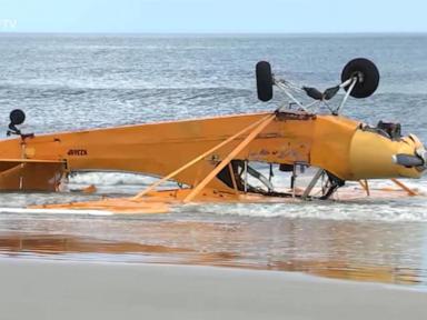 WATCH:  Pilot rescued after banner plane crashes into Florida surf