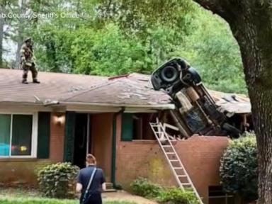WATCH:  Car lands on Georgia home in deadly crash