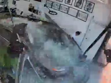 WATCH:  Car slams into tattoo shop