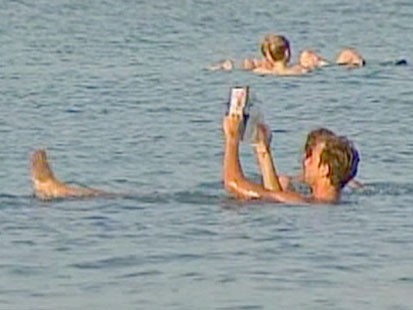 People floating in the Dead Sea