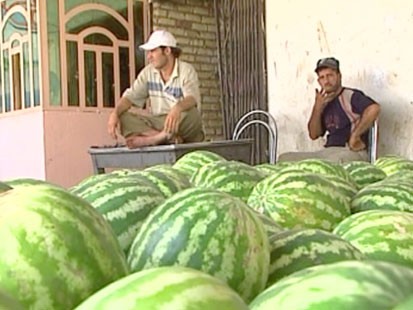 Men and watermelons