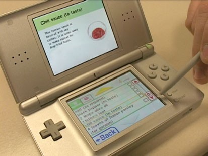 A picture of a Nintendo DS with the game Personal Trainer Cooking on it.