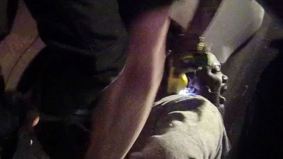 PHOTO: In this image made from a March 28, 2019, body-worn camera video provided by the Austin Police Department in Texas, Williamson County deputies hold down Javier Ambler as one of them uses a taser during his arrest in Austin, Texas. 