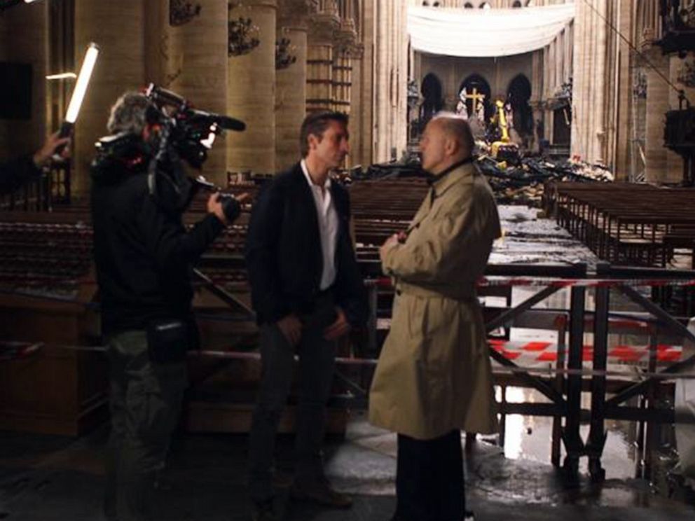 PHOTO: ABC News David Muir walks through the fire-damaged Notre Dame cathedral in Paris with retired French General Jean-Louis Georgelin in May 2019, nearly a month after a devastating fire.