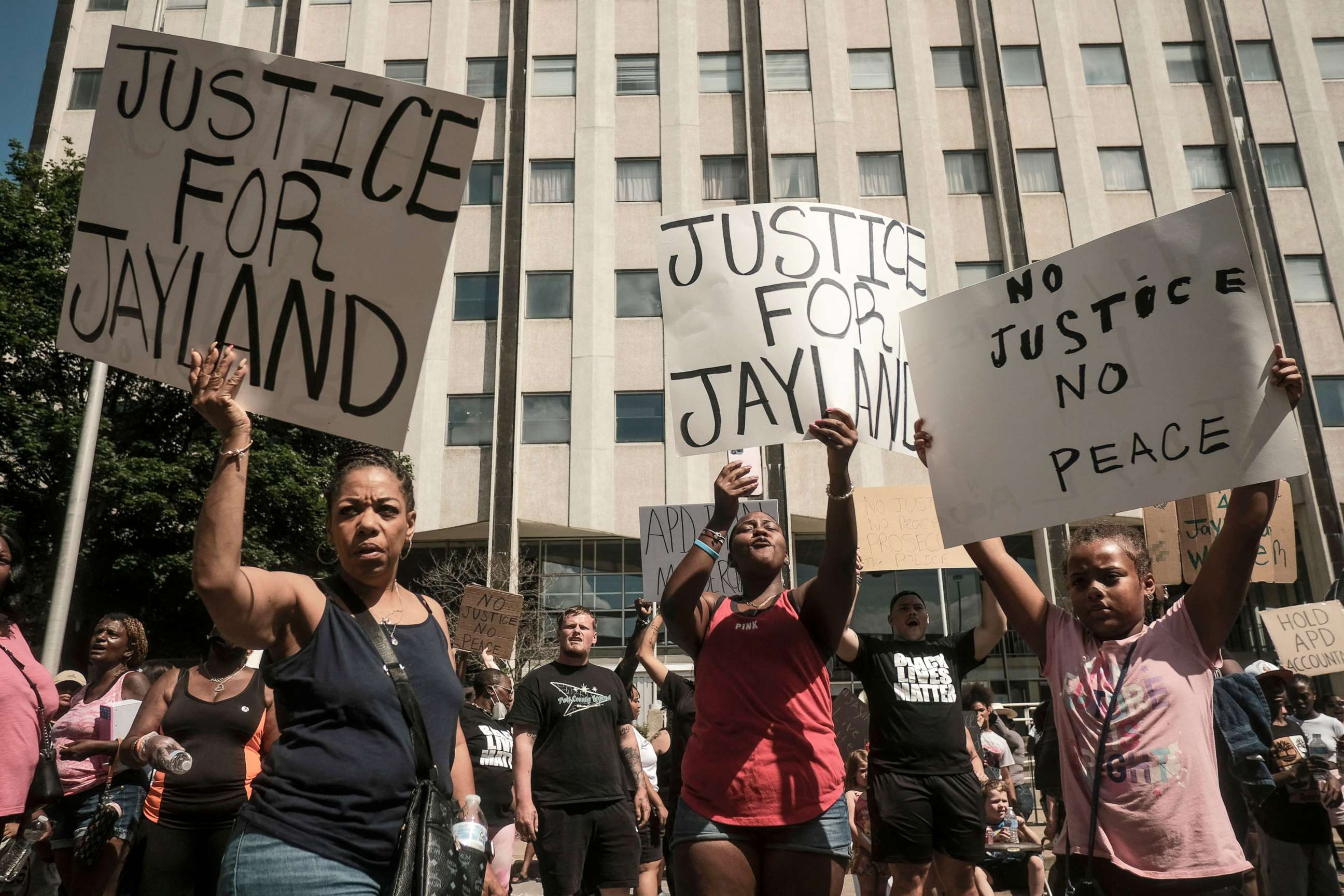 PHOTO: Demonstrators hold "Justice for Jayland" signs as they gather outside Akron City Hall to protest the killing of Jayland Walker, shot by police, in Akron, Ohio, July 3, 2022.