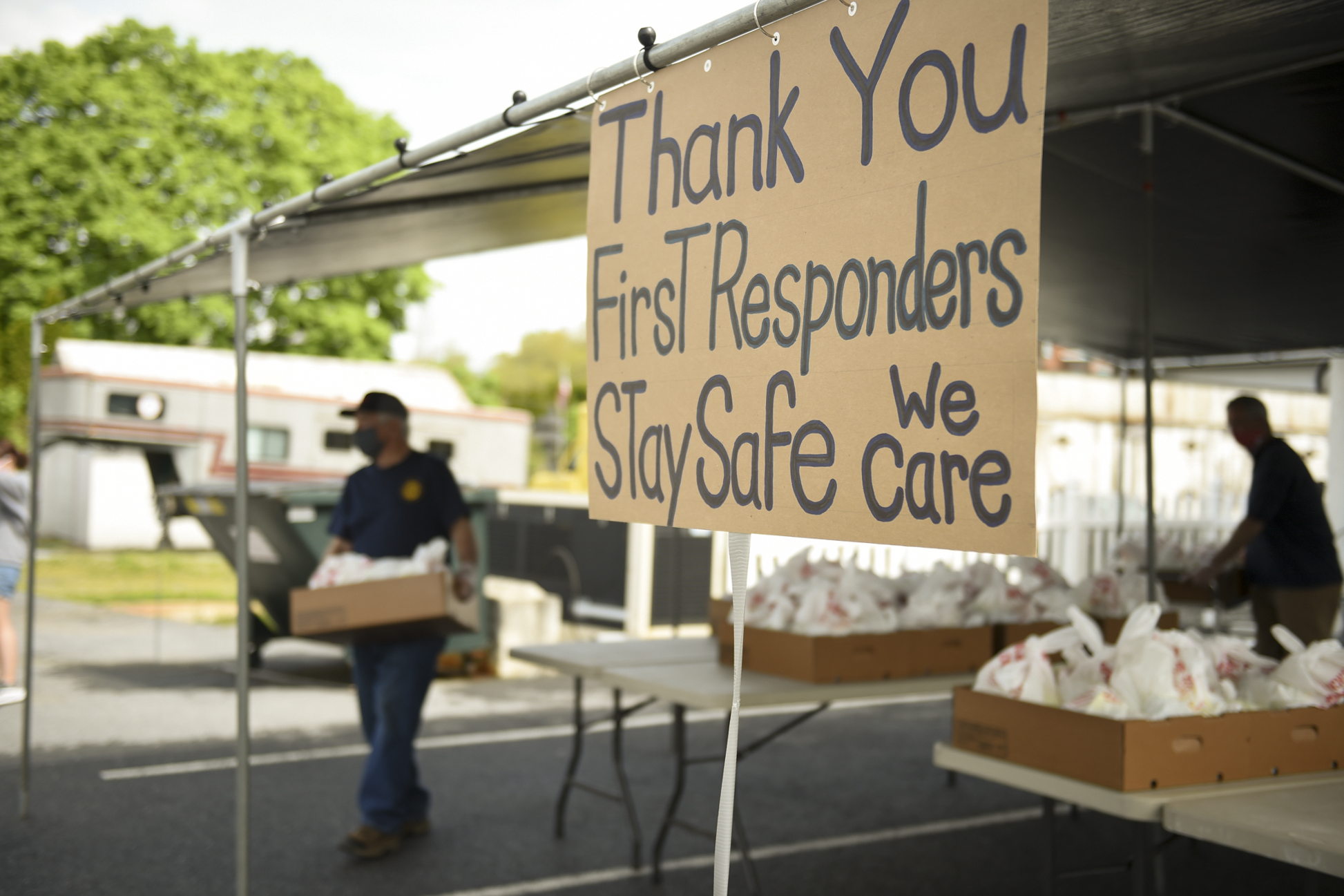 PHOTO: A sign reading "Thank you First Responders Stay Safe we care" greeting visitors as the Virginville Grange handed out chicken dinners, May 16, 2020, in Virginville, Pa., during the coronavirus outbreak.
