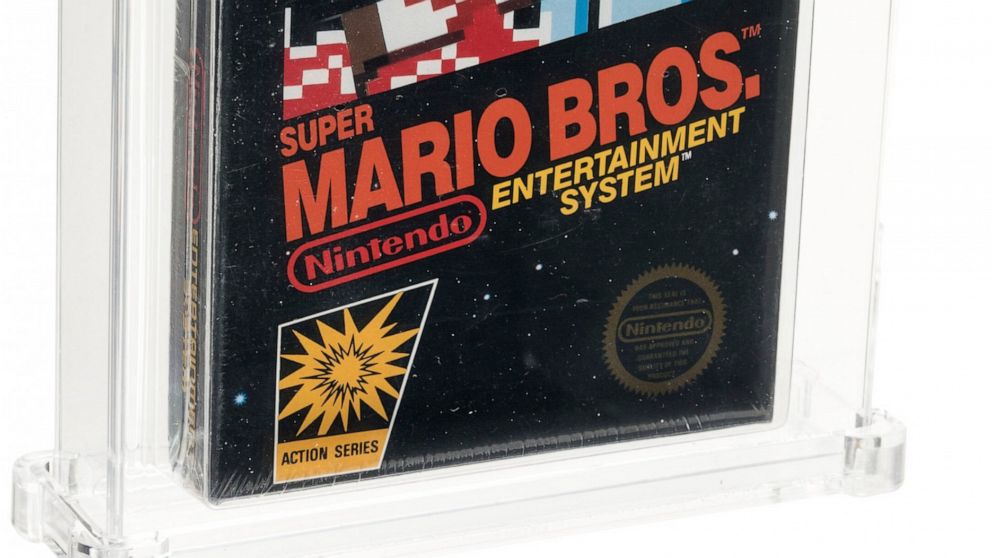 This photo provided by Heritage Auctions on Saturday, July 11, 2020, shows the front of an unopened copy of a vintage Super Mario Bros. video game that has been sold for $114,000 in an auction that underscored the enduring popularity of entertainment