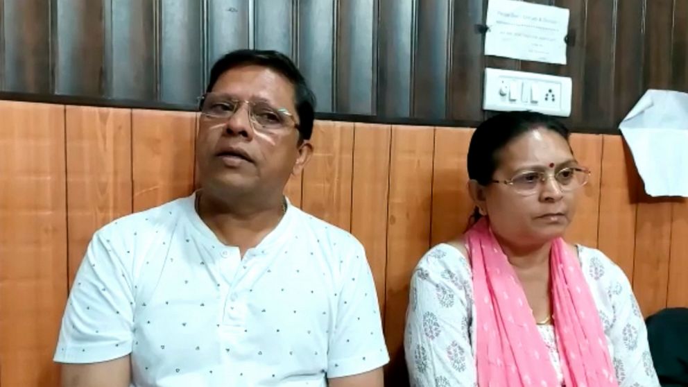 This image from video shows Sanjeev Ranjan Prasad, a 61-year-old retired government officer, and his wife Sadhana Prasad wait at a lawyer's chamber in Haridwar, India, Thursday, May 12, 2022. The Indian couple has sued their pilot son and daughter-in