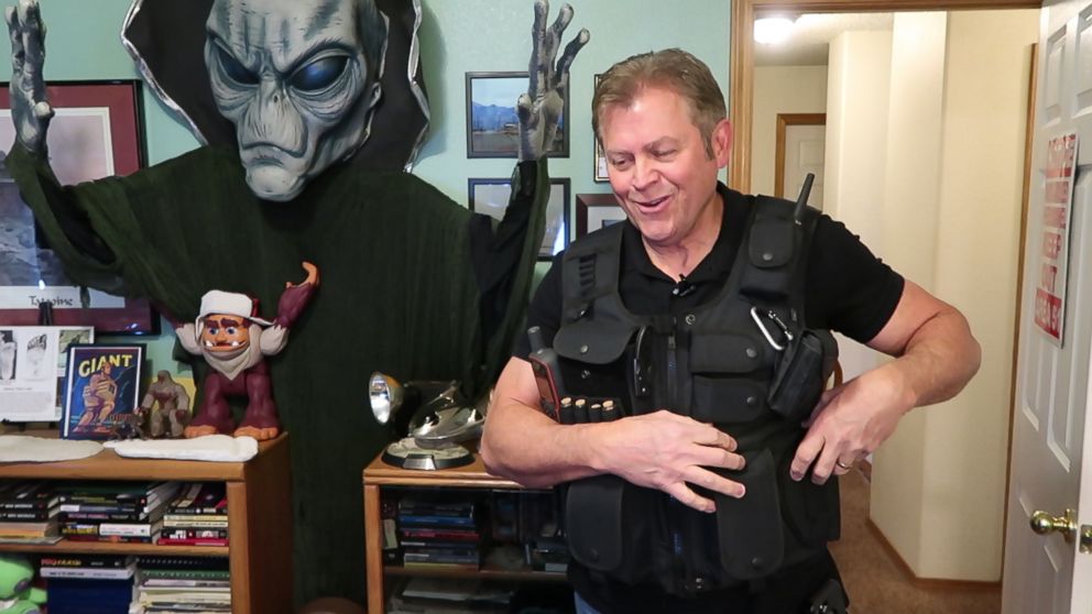 PHOTO: Chuck Zukowski wears a tactical vest and carries a gun whenever he investigates what he believes is alien activity along the 37th degree parallel of the United States in Colorado Springs, Colo.