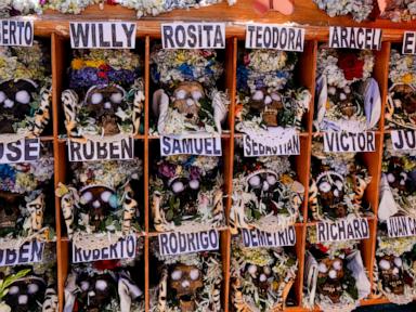 Bolivians carry adorned human skulls asking for favors in the Ñatitas festival in La Paz