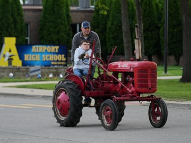 Michigan seniors arrive at school in style on Tractor Day
