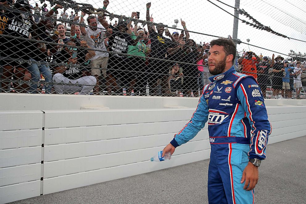 PHOTO: Fans cheer for Bubba Wallace, driver of the #43 Victory Junction Chevrolet, after the NASCAR Cup Series GEICO 500 at Talladega Superspeedway on June 22, 2020 in Talladega, Alabama.